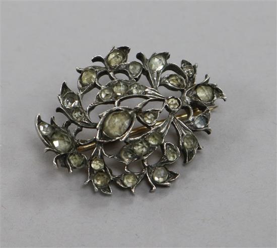 An Indian? white and yellow metal gem set pierced brooch, 32mm.